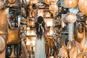 woman in white dress standing inside a store