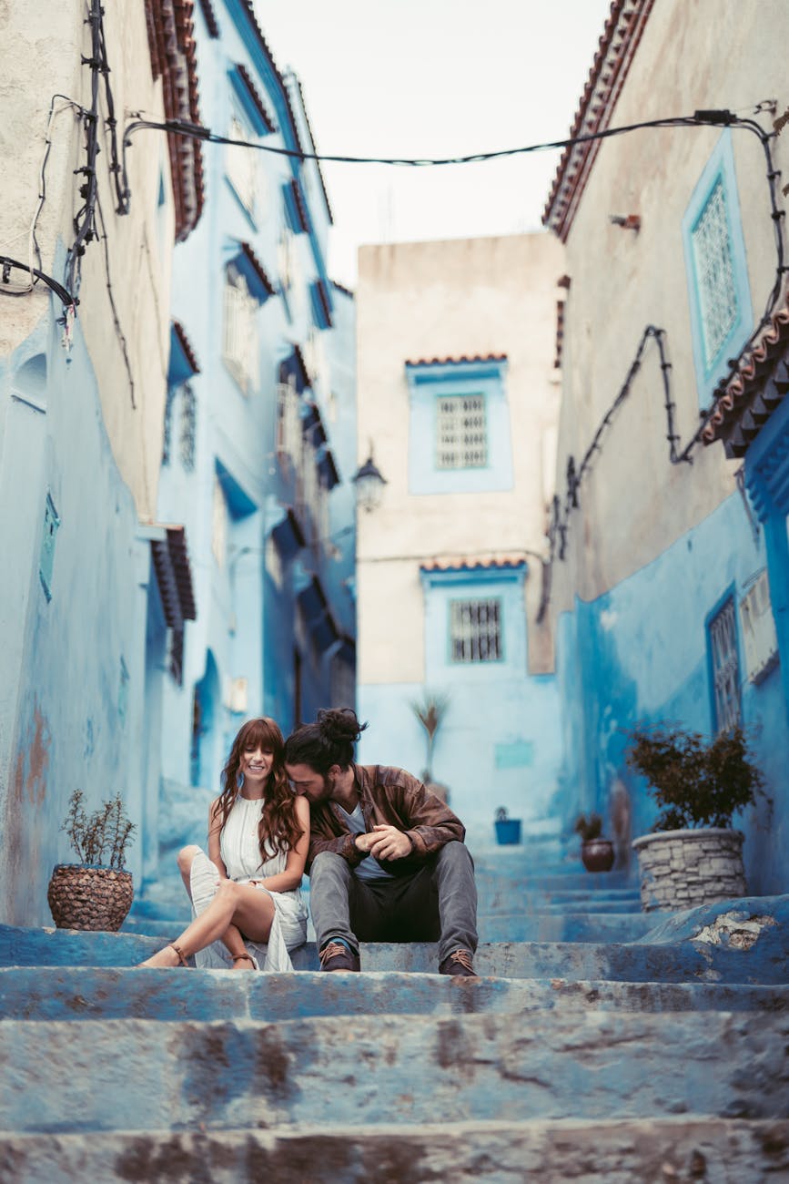 photo of couple sitting on stairway